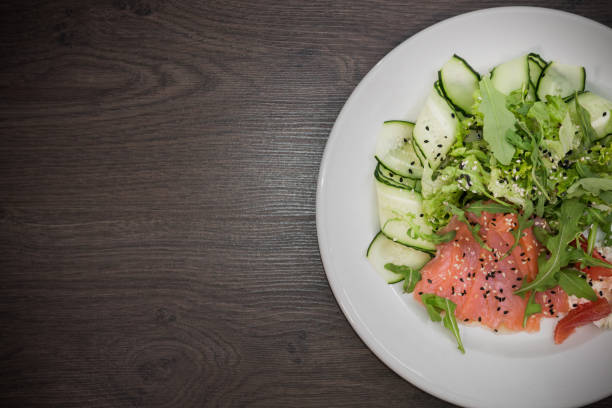 istock Meat of trout on a plate with vegetables and grapefruit 959031700