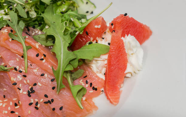 istock Meat of trout on a plate with vegetables and grapefruit 959031990