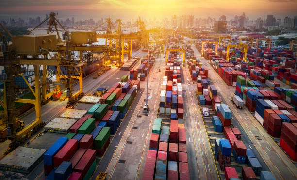 istock Logistics and transportation of Container Cargo ship and Cargo plane with working crane bridge in shipyard at sunrise, logistic import export and transport industry background 959035782