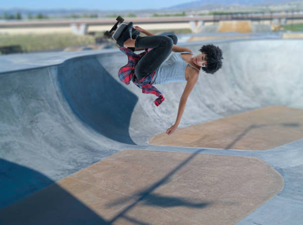 Venice Beach, CA - June 2, 2024 - Black and white image capturing candid, dynamic skateboarding action mid air at the iconic Venice Beach Skatepark