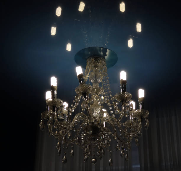 istock Modern electric bulbs shines in ceiling lustre in old classic style 959045720