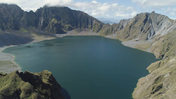 Crater Lake Pinatubo, Philippines, Luzon Crater lake of the volcano Pinatubo among the mountains, Philippines, Luzon. Aerial view beautiful landscape at Pinatubo mountain crater lake. Travel concept zambales province stock pictures, royalty-free photos & images
