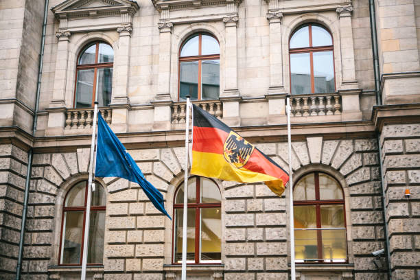 Flag of Germany and the European Union in Berlin. State symbol and national government flag of the Federal Republic of Germany and EU Flag of Germany and the European Union in Berlin. State symbol and national government flag of the Federal Republic of Germany and EU. coalition building stock pictures, royalty-free photos & images