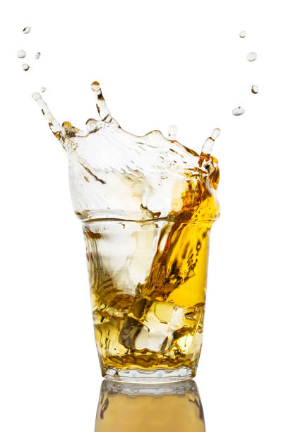 istock Glass of apple juice with splash 959067146