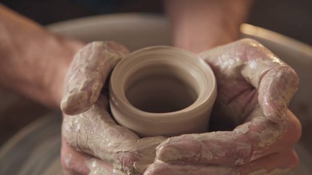 istock Work in the pottery workshop: clay ware on the potter's wheel 959067208