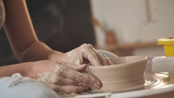 istock The master ceramist works in his studio. Close-up, only hands 959070162