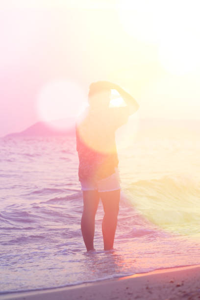 man happy with the sunset on the beach