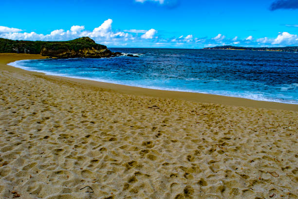 Small sandbar where the Pacific ocean and the Santa Clara river meet at Surfers Knoll beach in Ventura California United States