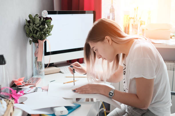 istock Teenager doing homework 959076560