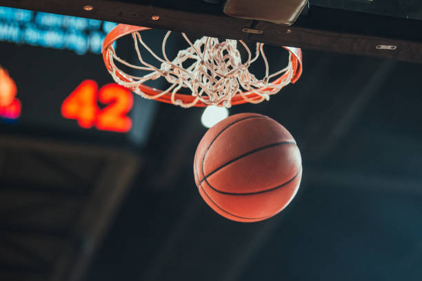 basketball Basketball hoop, basketball scoring in the stadium basketball sport photos stock pictures, royalty-free photos & images