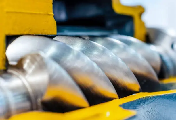 Cross section of the air compressor. Rotor of air screw compressor. Close-up photo. Shallow depth of field.