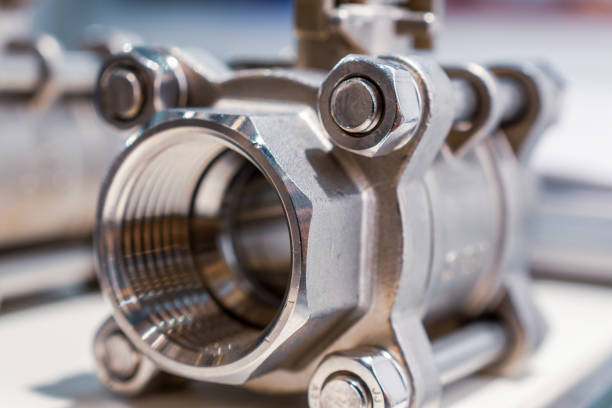 Steel ball valve. Modern shut-off valves, abstract industrial background.