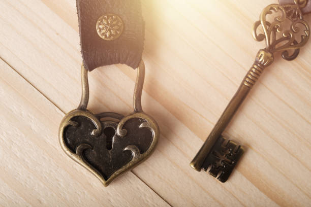 istock Valentines day background. Red heart on wooden table with copy space 959081882