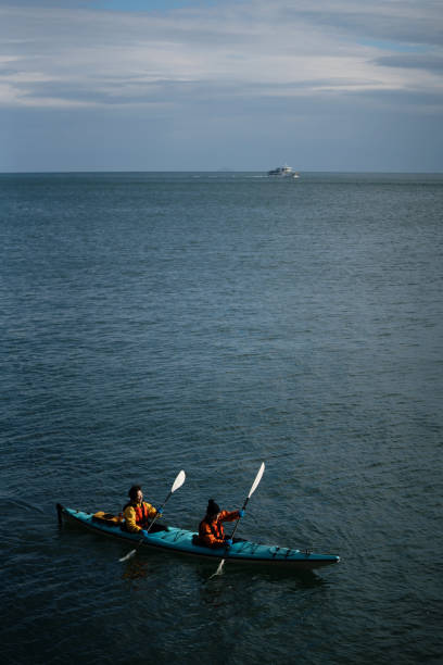 Two women sea kayaking in the ocean