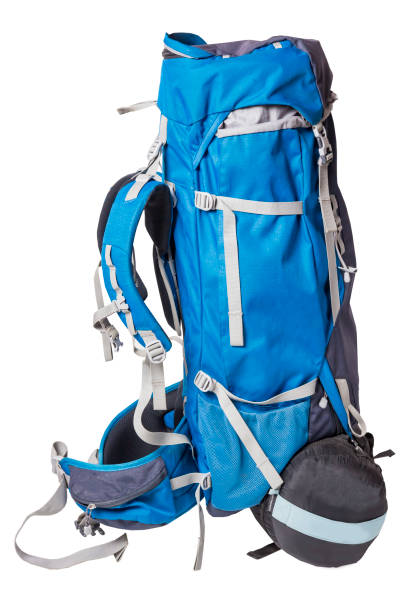 istock Blue backpack for hiking isolated on white background. side view of a professional backpack for hiking trips with a sleeping bag. Outfit for hikes. 959094620