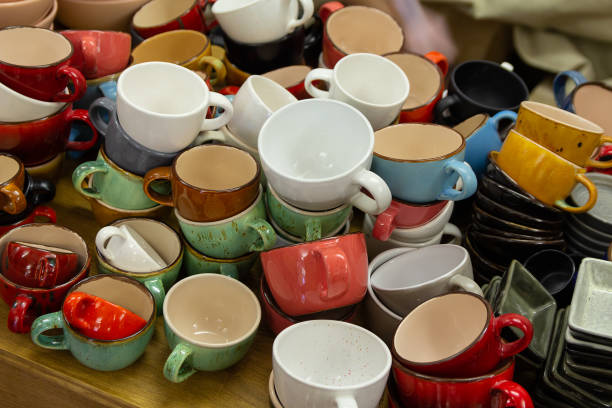 istock Multi-colored ceramic mugs on the counter of the store 959094666