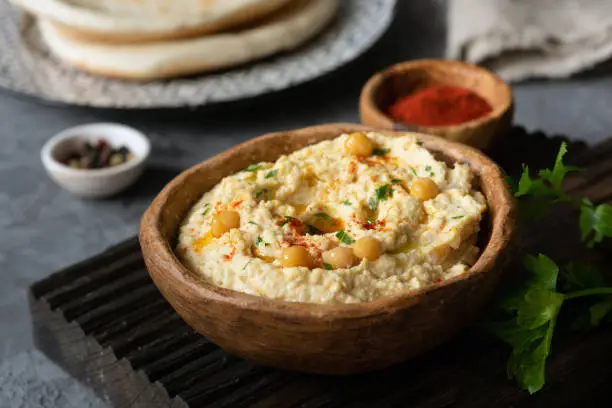 Hummus Chickpea in bowl. Homemade hummus. Bowl of arabic or lebanese vegetarian hummus. Selective focus