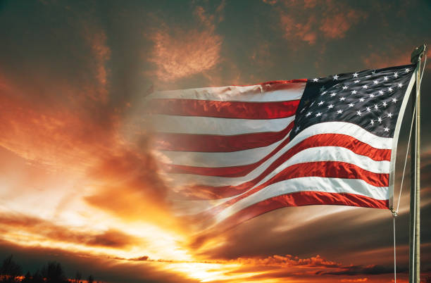 istock american flag against the sky at dusk 959100300