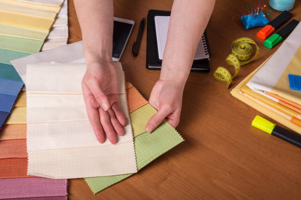 istock Choice of fabric for sewing, sewing accessories, on desktop 959105698