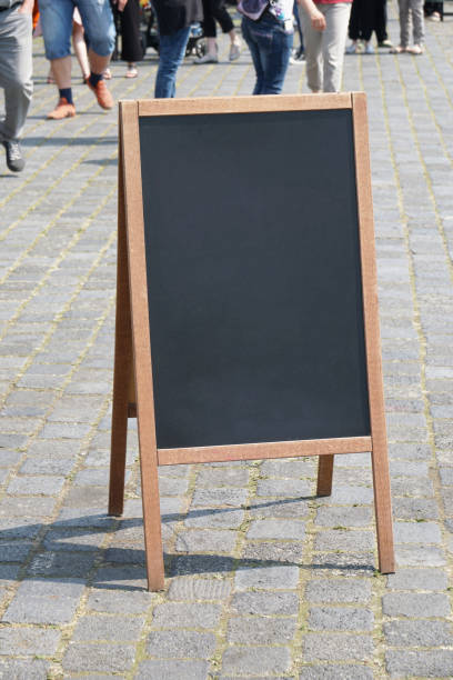 istock blank blackboard chalkboard advertising a-frame sign or customer stopper 959105838