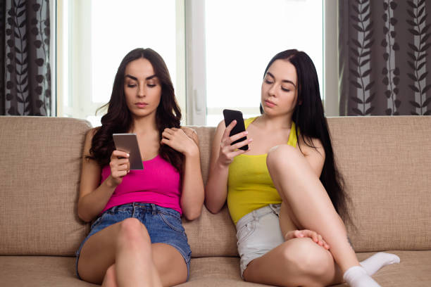 istock Two women with phones 959110010