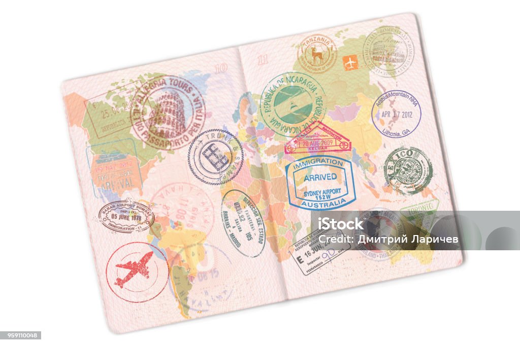 Passport and lot of stamps on it. Isolated on white background Passport and lot of stamps on it. Isolated on white background. Passport Stock Photo