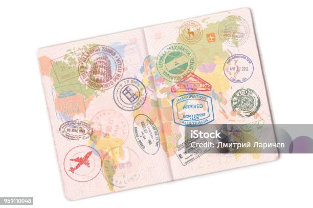 Passport And Lot Of Stamps On It Isolated On White Background Stock Photo - Download Image Now