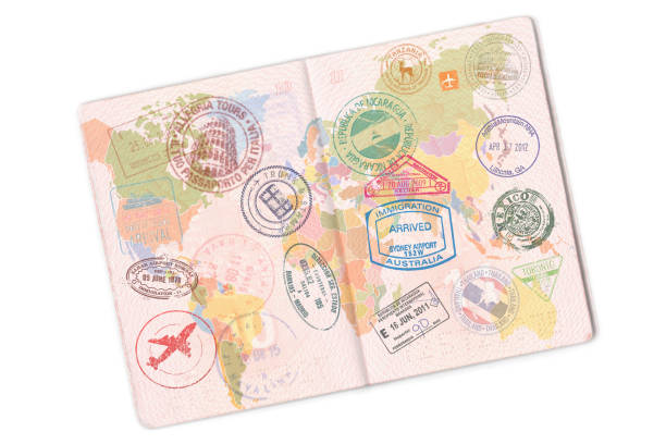 passport and lot of stamps on it. isolated on white background - emigration and immigration passport passport stamp usa imagens e fotografias de stock