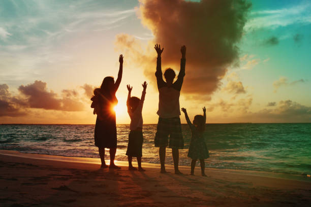 istock happy family with kids having fun at sunset 959110106