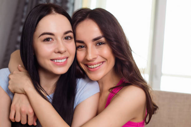 istock Two young beautiful girl friends 959110286