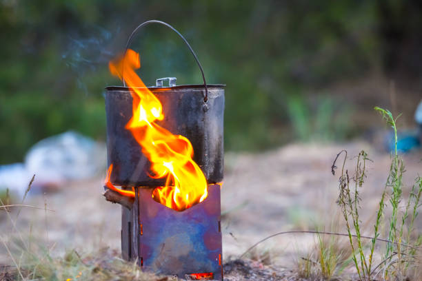 istock touristic wooden stove with cauldron on a fire 959114790
