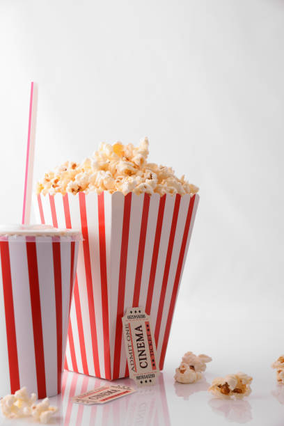istock Drink popcorn and movie tickets on white background vertical 959115176