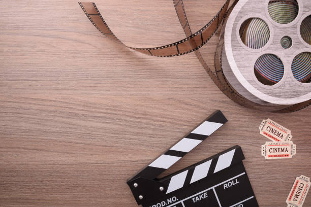 istock Equipment and elements of cinema on wood table top horizontal 959115316