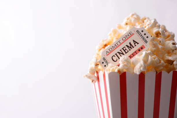 istock Popcorn and movie tickets on white background top view 959115368