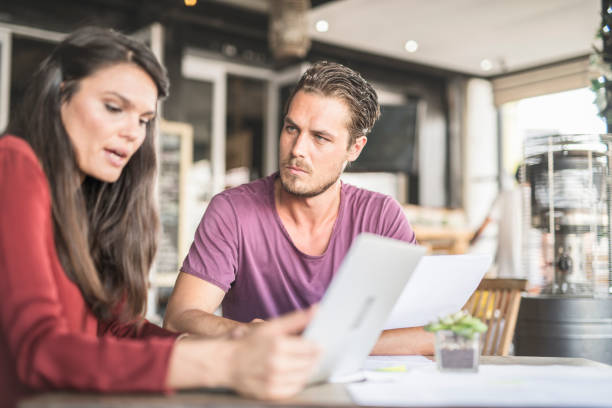 istock Business colleagues discussing at table at restaurant. 959115836