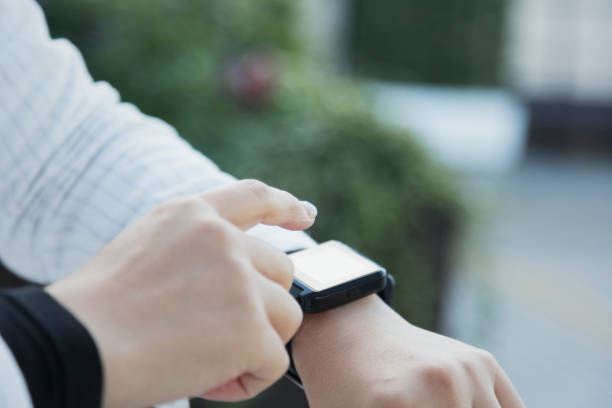 istock Woman using a smart watch at the airport 959116076