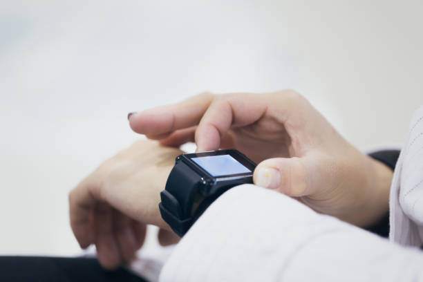 istock Woman using a smart watch at the airport 959116080