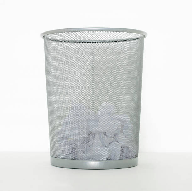 istock WASTE PAPER LITTER BIN HALF FULL OF PAPER 959121478