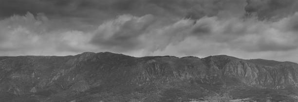 istock Gray stormy sky over mountain.Dramatic wild landscape, black&white 959128326