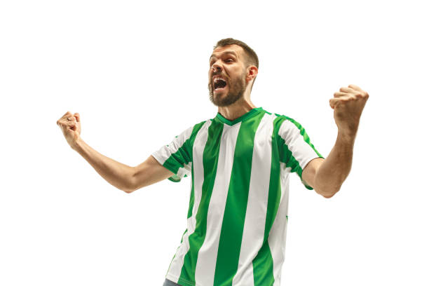 istock Irish fan celebrating on white background 959131386