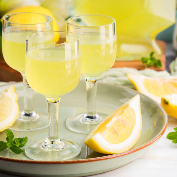 istock Home made limoncello in stemmed glasses 959134032