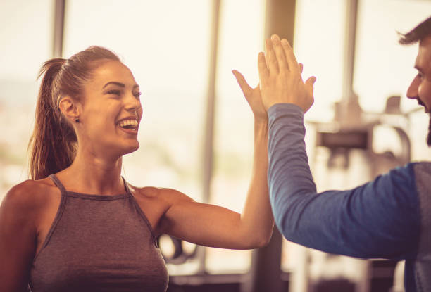 istock Cheerfully couple at gym. 959134400