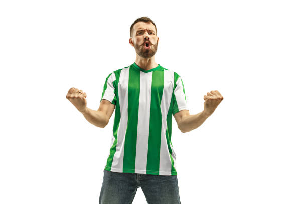 istock Irish fan celebrating on white background 959134760