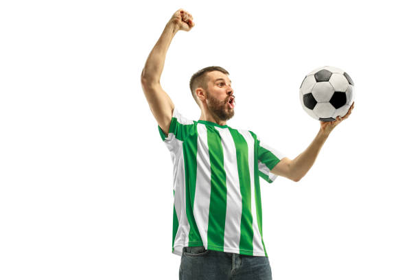 istock Irish fan celebrating on white background 959138536