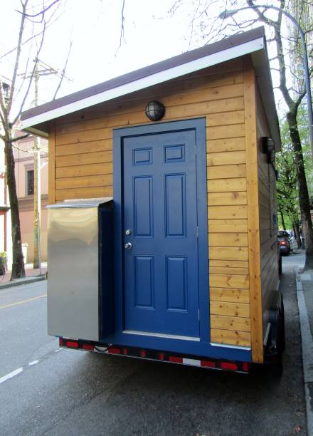 Wooden trailer parked on street.