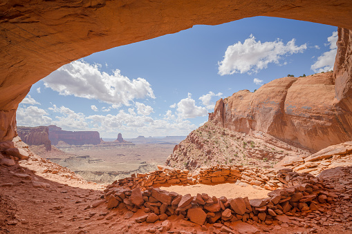 An old circle of sandstone known as False Kiva sits high above the valley floor of Canyonlands National Park tucked away in a hidden alcove in a remote section of the Island In The Sky park, Utah, USA.
