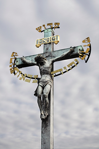Monte Amiata, Italy - 18 August 2022 - In Val d'Orcia, Tuscany region, soar the Amiata mount, an ancient volcano, now a tourist beech forest with a monumental summit cross and rocks for climbing. Here in particular the monumental cross in the summit at 1725 meters