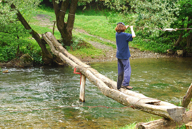 istock young girl is going over the river 95914696