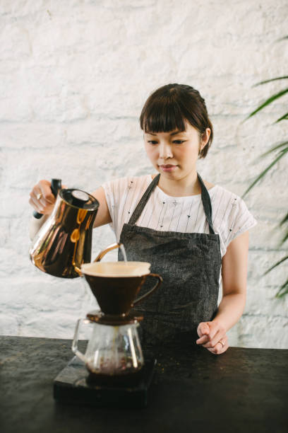 istock Focused Japanese barista maks speciality coffee 959147032