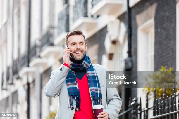 Elegant Smiling Man Talking On Phone On The London Street Stock Photo - Download Image Now